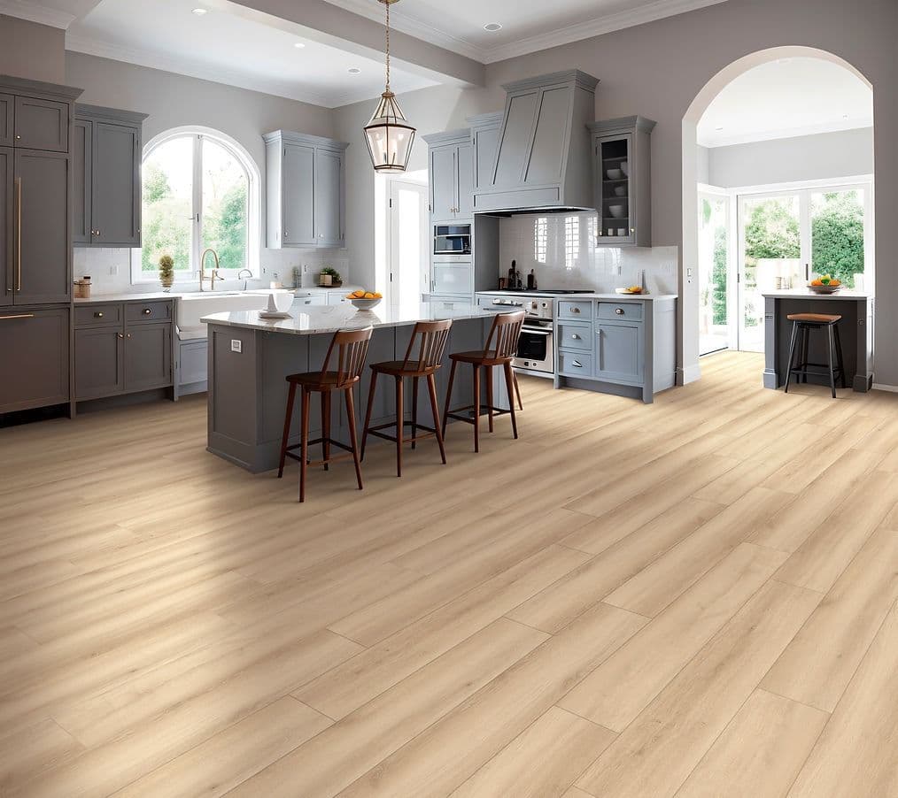 A kitchen with dark gray cabinets and new light-colored LUX vinyl plank flooring.